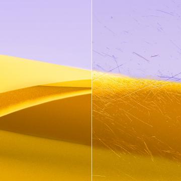 Imágenes divididas de un lente transparente y limpio con ZEISS DuraVision Gold UV y un lente con gotas de agua.